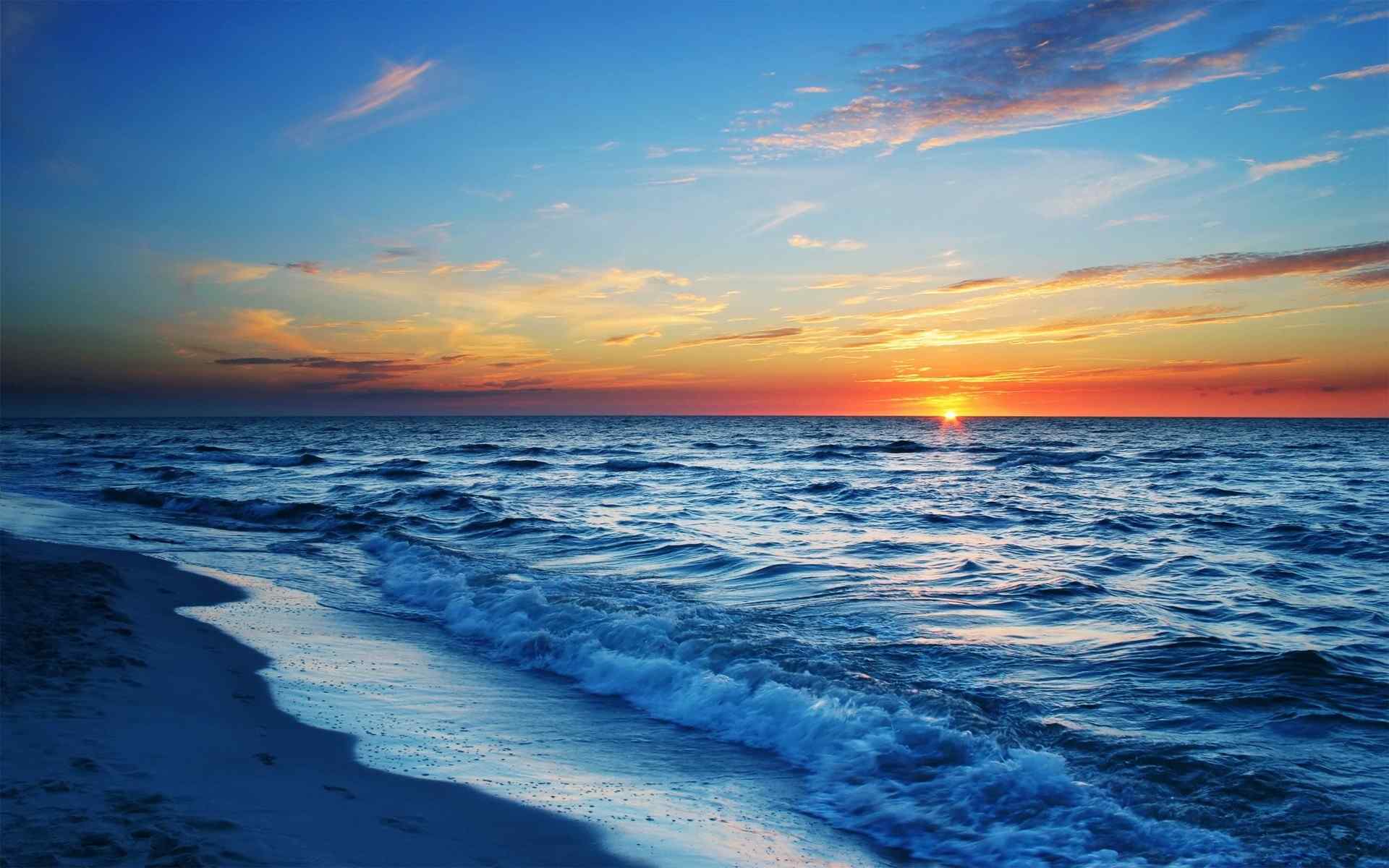 海浪落日夕阳唯美的海景桌面壁纸